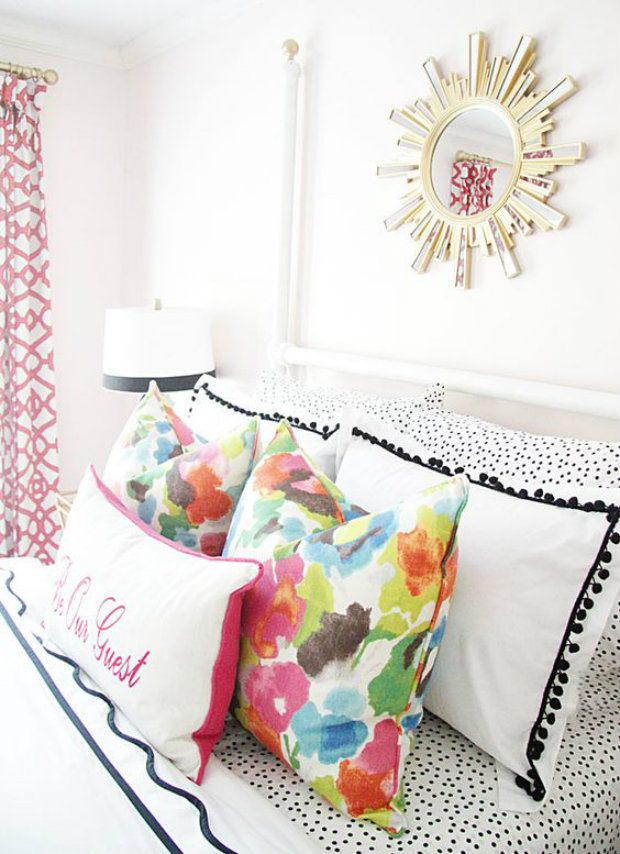 The summer decor in this bright bedroom add a flirty a carefree touch.