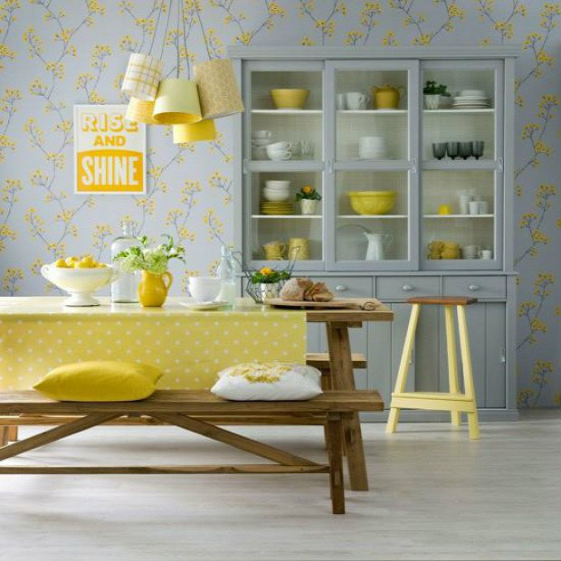 The yellow from the wallpaper pattern ties into the yellow polka-dot table cloth and yellow accents.
