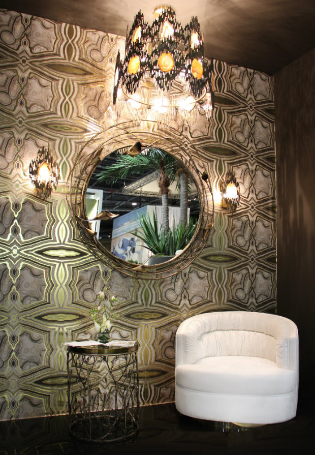 The agate patterns from the Vivre Sconces and Vivre 2-Ring Chandelier, and the floral patterns from the Enchanted Side Table and Stella Mirror complement the metallic agate wallcovering in this KOKET project.